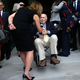 A reporter interviews retired weather anchor Willard Scott outside the Washington National Cathedral. (Richard Prince)